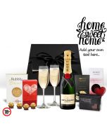 Luxury housewarming gift boxes with Champagne and chocolates.