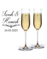 Engraved personalised crystal Champagne glasses with couple's first names and date.