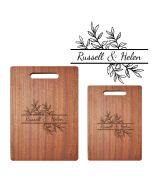 Personalised chopping boards with couple's names engraved.
