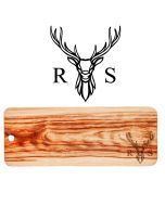 Large wooden platter grazing boards engraved with a stag head design and a person's initial