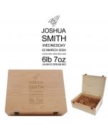 Personalised baby keepsake boxes with engraved rocket design and babies details.