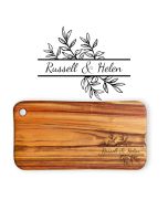 Hardwood cutting boards laser engraved with leafy design and couple's first names