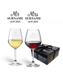 Wedding gift set of personalised crystal wine glasses.