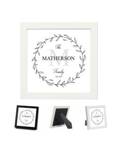 Framed plaque with family name design and year established in a beautiful floral themed round border.