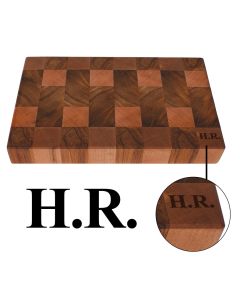 Rimu wood chopping board engraved with initials in the corner. Butchers block construction.