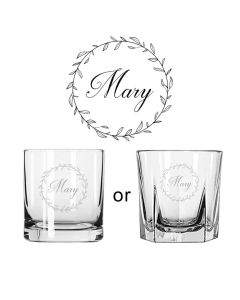 Tumbler whiskey glasses with laser engraved floral design and name.
