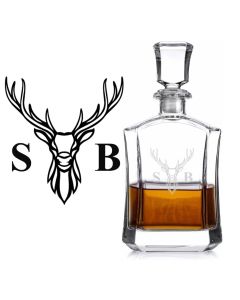 Crystal decanter with engraved stag head design and two initials.