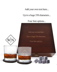 Whiskey glasses and accessories gift boxes with engraved text on the lid.