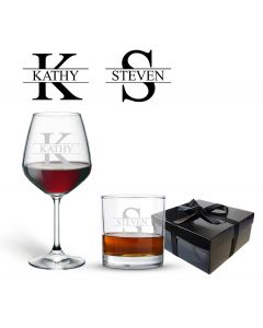 tumbler glass and wine glass both engraved with any name and initial, positioned in front of a black gift box with a satin bow