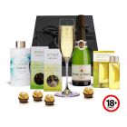 Indulgence gift pack with bubbles, chocolates and beauty products.