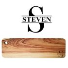 Long wood platter board engraved with a person's initial and name