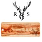 Large wooden platter grazing boards engraved with a stag head design and a person's initial