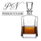 Crystal decanter laser engraved with fancy script subtle initials and name design.