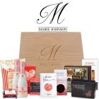 Luxury gourmet treat gift boxes for women filled with chocolates, sparkling wine and more.