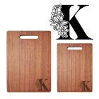 Wood chopping boards engraved with floral initial design.