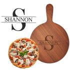 Personalised wood pizza boards with engraved initial and name design.