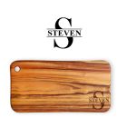 Solid wood chopping board engraved with a single initial and name through the center