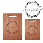 Solid wood chopping board with floral design and name engraved.